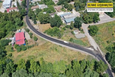 На автодороге в поселок Элитное завершили укладку выравнивающего слоя из асфальтобетона